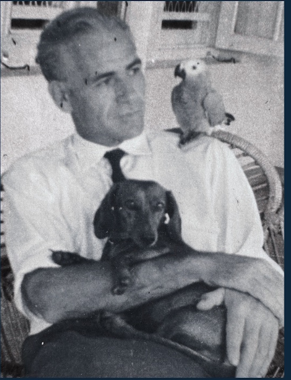 Tim, co-founder of Dirty Dog Washes, with a dachshund.